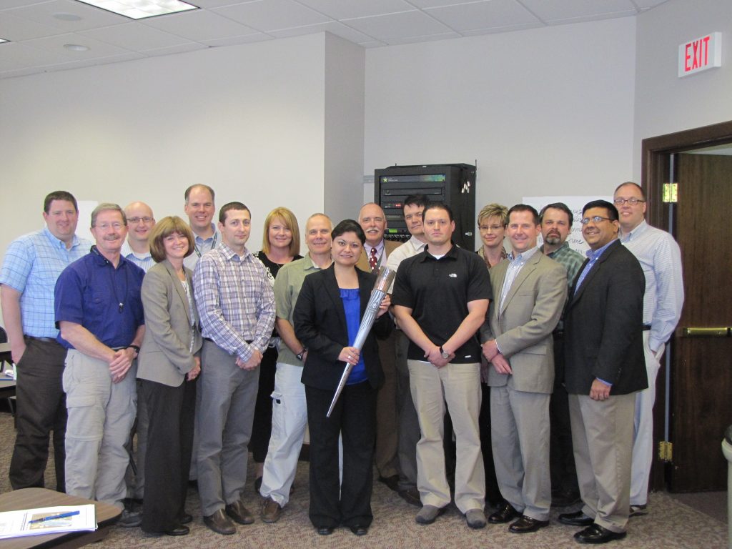 group of people inside an office smiling