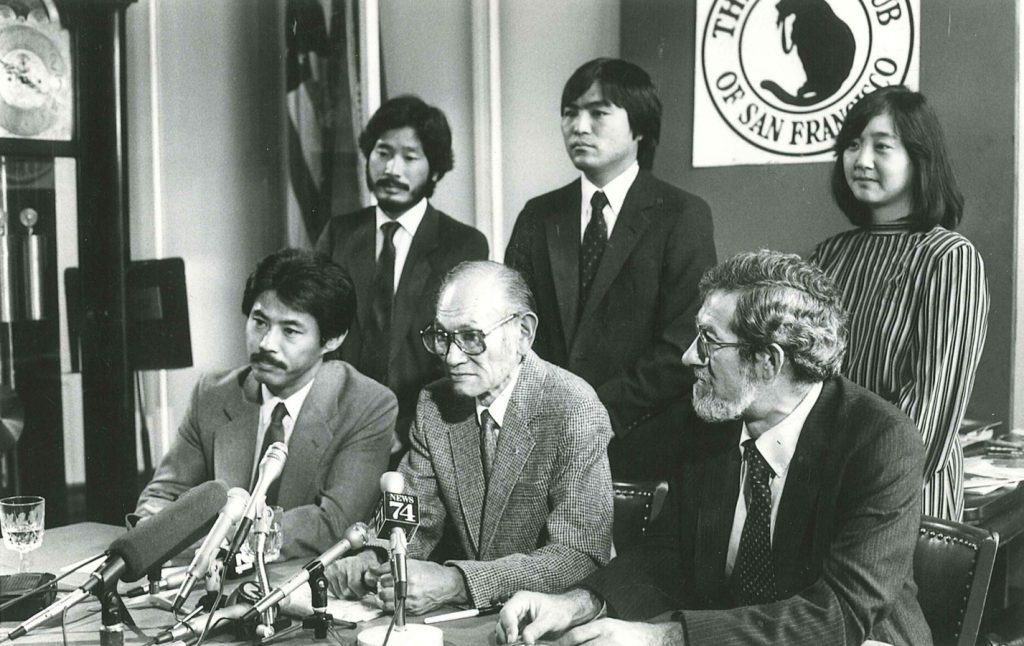 People at a table, black and white image