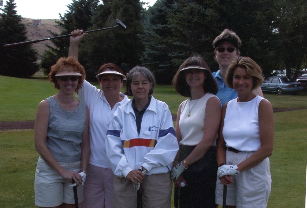 Diane and group of women in golf outfits.