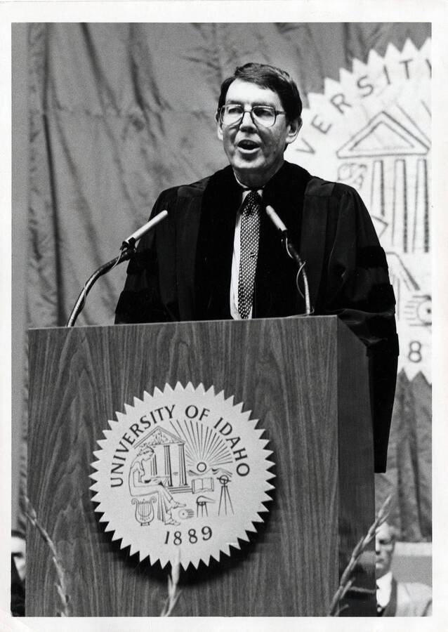 man speaking at a podium