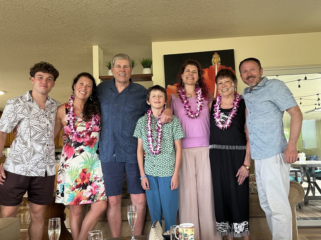 man and family smiling