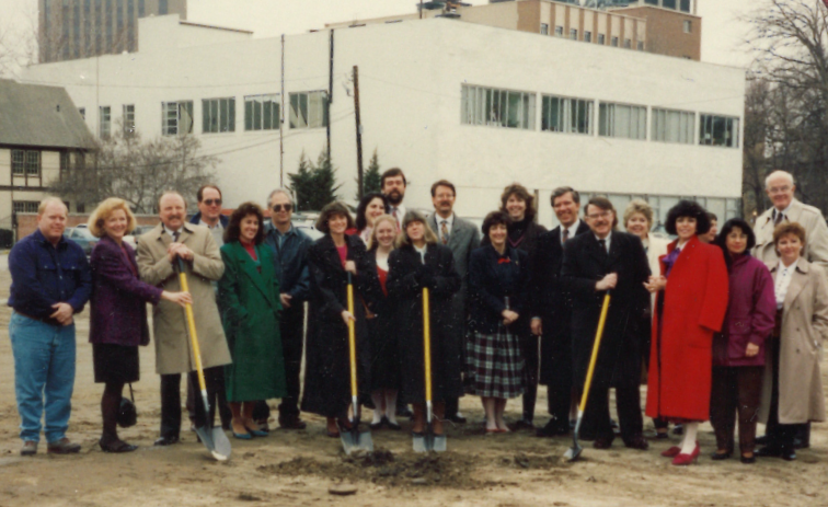 group of people holding shovel