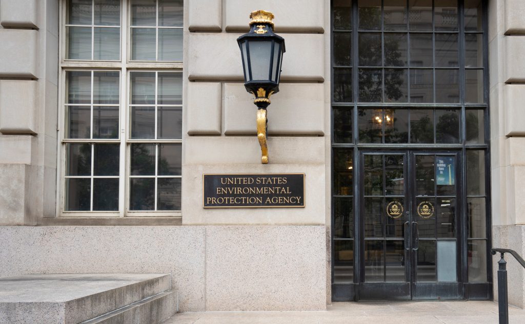 image of the EPA building, stone and black doors and windows