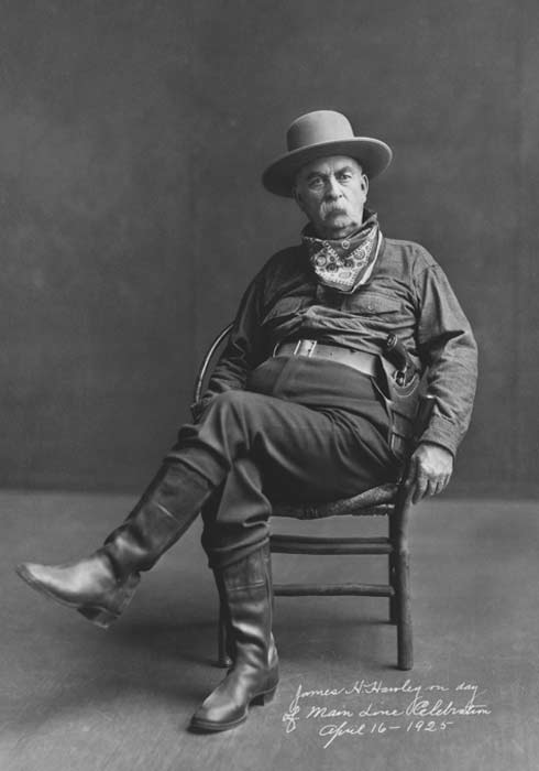 Image of James Hawley sitting in a chair, black and white.