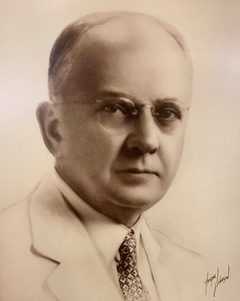 sepia image of man with glasses