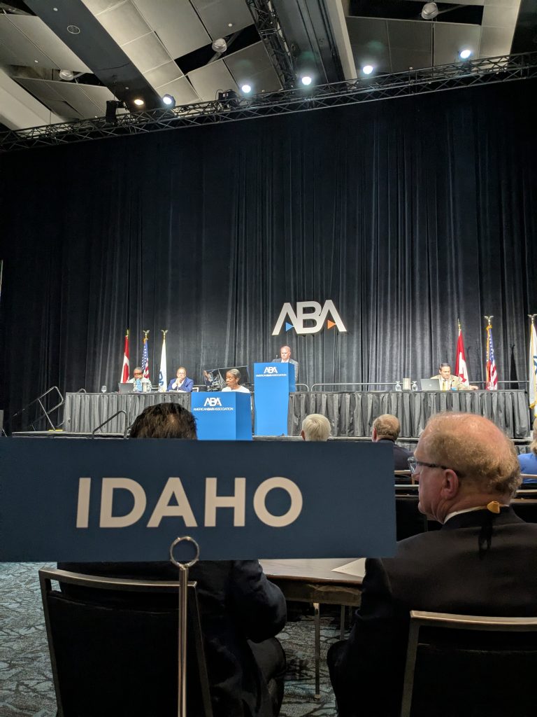 man at podium at ABA conference with Idaho in the front image