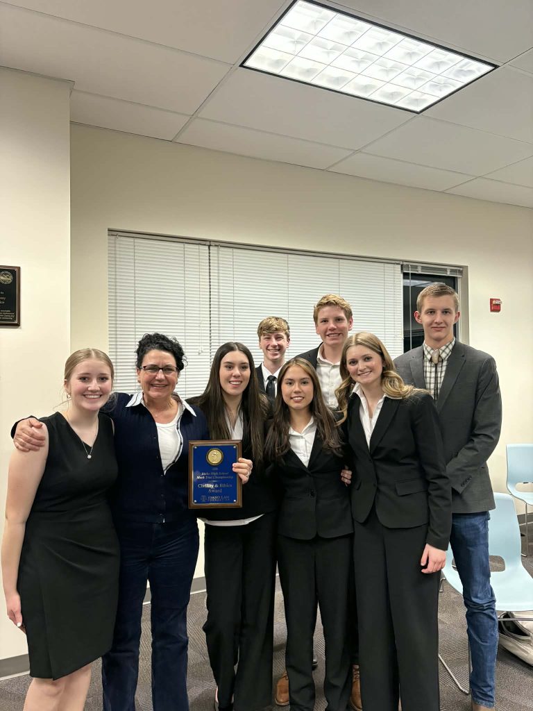 students smiling with award from greenleaf friends academy