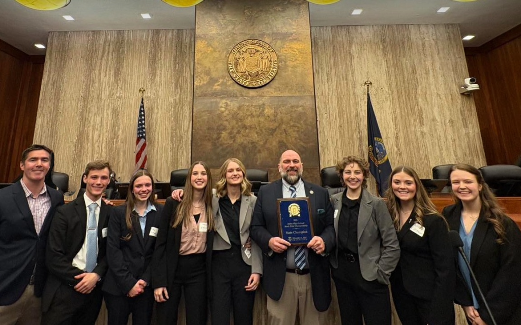 group of students smiling inside idaho supreme court building
