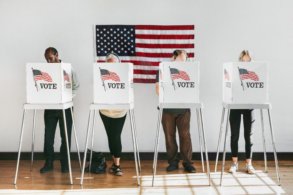 image of people standing at voting booths for usa elections