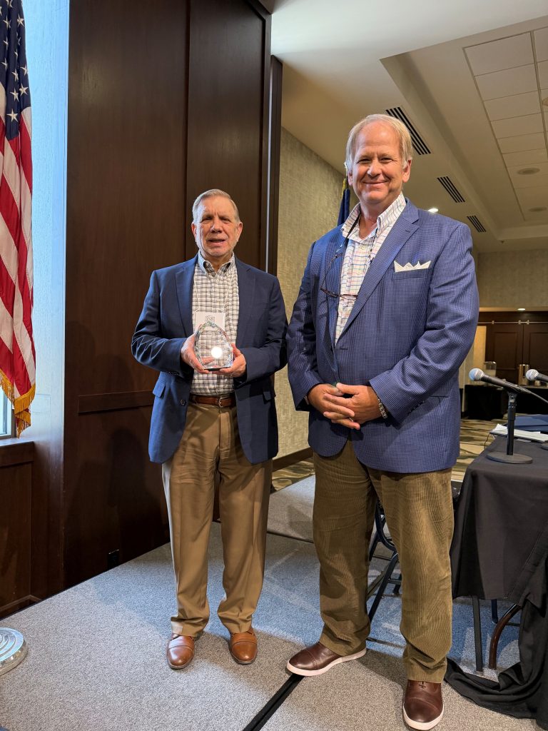 Workers’ Compensation Professionalism Award Given to James C. Arnold and presented by Fred Lewis. Photo courtesy of Teresa Baker